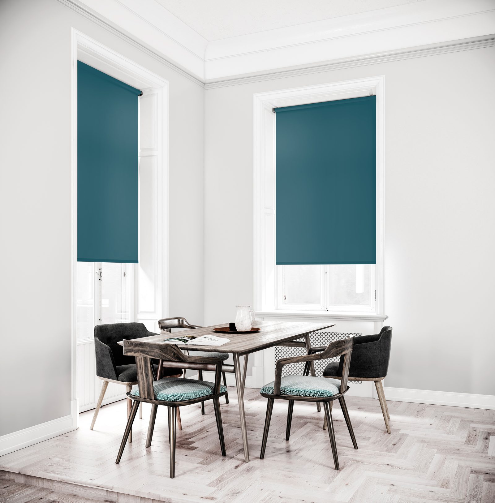Teal Como roller blinds on two tall windows in a bright white dining room with a wooden table and chairs